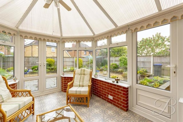 This large conservatory at the back of the property adds a touch of class. It is bright and comfortable, with windows overlooking the garden and doors leading outside.