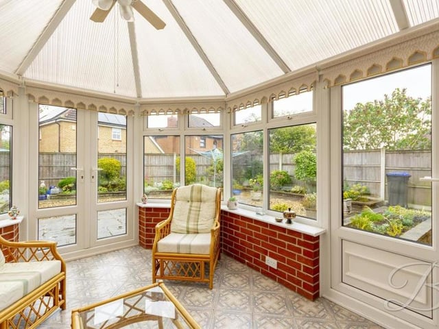 This large conservatory at the back of the property adds a touch of class. It is bright and comfortable, with windows overlooking the garden and doors leading outside.