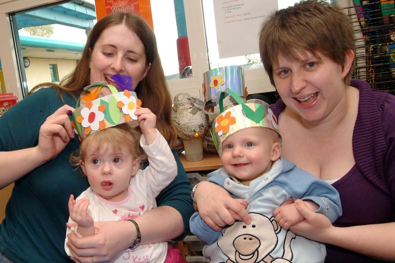 Kath Cooper with daughter Rebekah and Victoria McCormick with son Oliver show off their Easter artwork after making bonnets at the Broomhill Children's Centre Easter party in 2009.