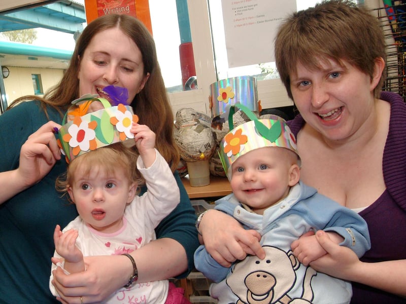 Kath Cooper with daughter Rebekah and Victoria McCormick with son Oliver show off their Easter artwork after making bonnets at the Broomhill Children's Centre Easter party in 2009.