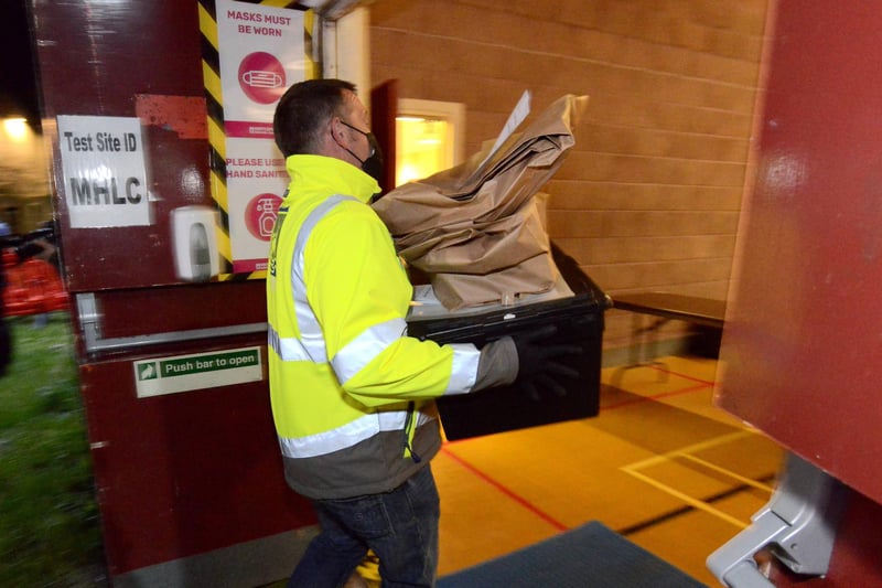 Ballot boxes are brought inside the Mill House Leisure Centre.