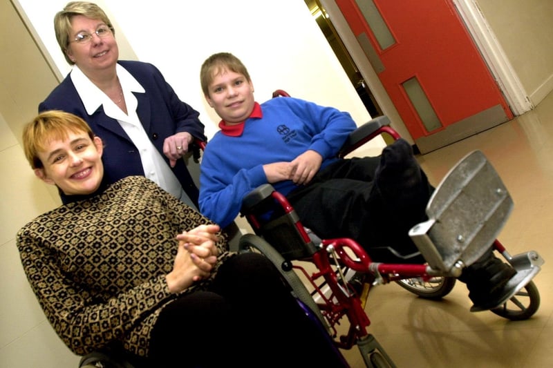 One of Britain's Paralympic stars, gold medallist wheelchair racer Tanni Grey Thompson, visited Stocksbridge High School to open their new disabled facilities in November 2001. She is pictured meeting pupil Brian Hackworth and headteacher Jan Featherstone