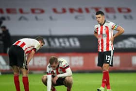 Oli McBurnie and John Egan of Sheffield United look dejected following the final whistle of Sunday's game against Leicester City: Simon Bellis/Sportimage