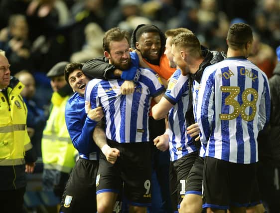 Super-sub Steven Fletcher is mobbed by his team-mates after scoring a 94th minute winner for Sheffield Wednesday against Charlton Athletic at Hillsborough tonight. Photo: Steve Ellis