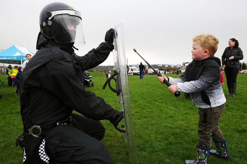 Alfie Adams, age 6, from Maddiston finds out more about police riot wear.