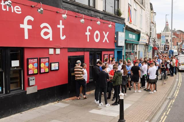 England supporters gather outside The Fat Fox pub ahead of the England v Italy Euro 2020 cup final. Picture: Keith Woodland (110721-15)