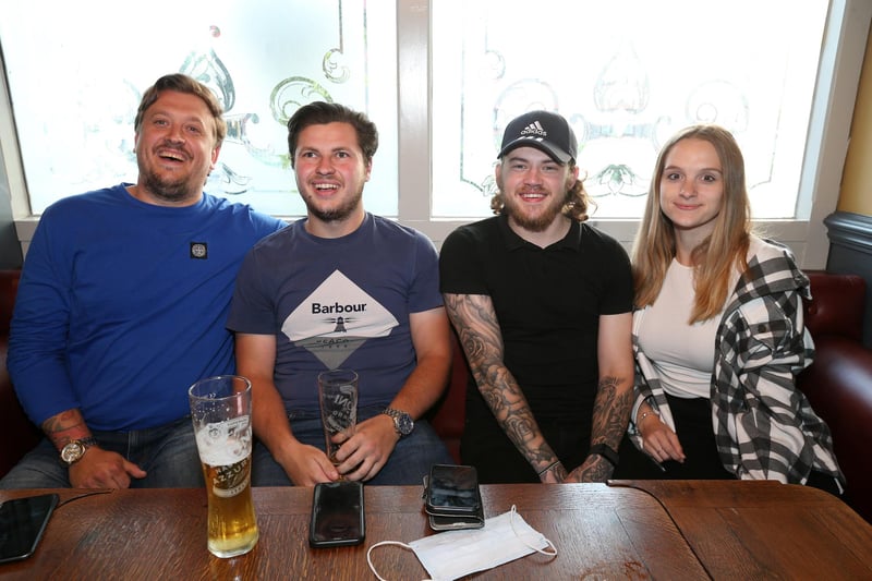 From left, Sam Sharp, Jake Binding, Ethan Mortimer and Jessica Watt. Fans watch England v Czech Reublic in England's third Group D game of Euro 2020, in The Star & Garter pub, Copnor, Portsmouth. Picture: Chris Moorhouse (jpns 220621-20)