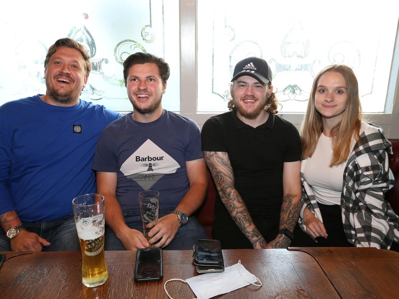 From left, Sam Sharp, Jake Binding, Ethan Mortimer and Jessica Watt. Fans watch England v Czech Reublic in England's third Group D game of Euro 2020, in The Star & Garter pub, Copnor, Portsmouth. Picture: Chris Moorhouse (jpns 220621-20)