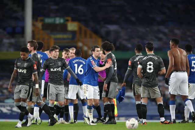 Sheffield Wednesday and Everton players exchange pleasantries at the end of tonight's FA Cup fourth round tie at Goodison Park, which the Toffeemen won 3-0. (Photo by Clive Brunskill/Getty Images)