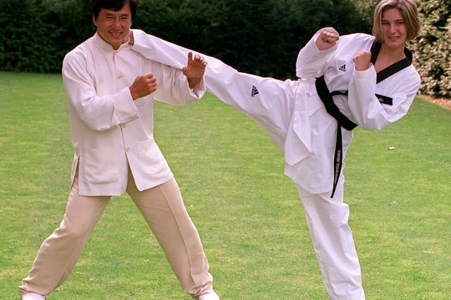 Doncaster schoolgirl Sarah Stevenson, aged 17, the first woman to be selected for the Taekwondo Great Britain Olympic team, with cult martial arts actor Jackie Chan, in London  in 2000.