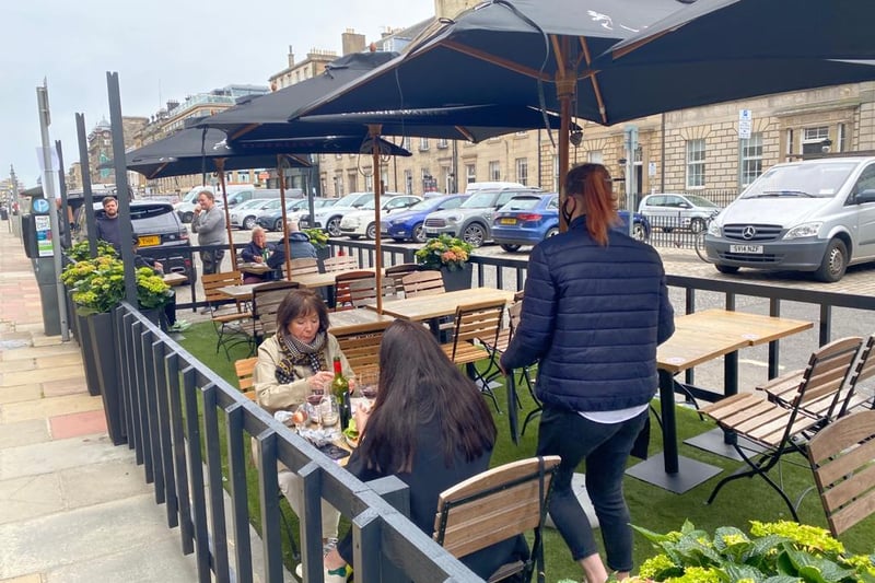 It might be a little chilly, but customers in Edinburgh have shown they are eager to get back to pubs and restaurants as pictures show them enjoying a drink and a bite to eat in outdoor seating areas in the Capital.