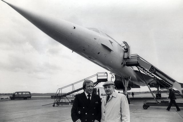 Charles Rowland of Sheffield under the fuselage of Concorde with his son David Rowland who was the co-pilot of the Concorde jet when it landed at Finningley Show