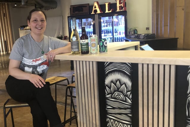 Jules Gray, co-owner of Hop Hideout, is pictured at the shop in Kommune, the food hall in Castlegate in Sheffield - the business moved from Abbeydale Road when the hall opened, and specialises in beers in bottles and cans. (www.hophideout.co.uk)