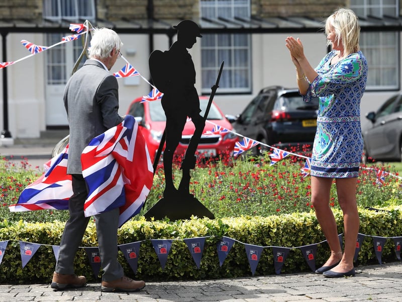 Gosport MP Caroline Dinenage and Terry Hinkley unveiling an RBLI Unknown Tommy  figure, paid for with Pavilions Neighbourhood Watch members contributions and supported by Abri housing.