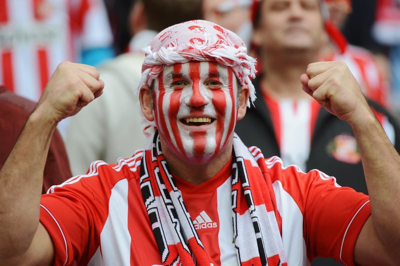 A Sunderland fan cheers prior to the Capital One Cup final between Manchester City and Sunderland at Wembley Stadium.
