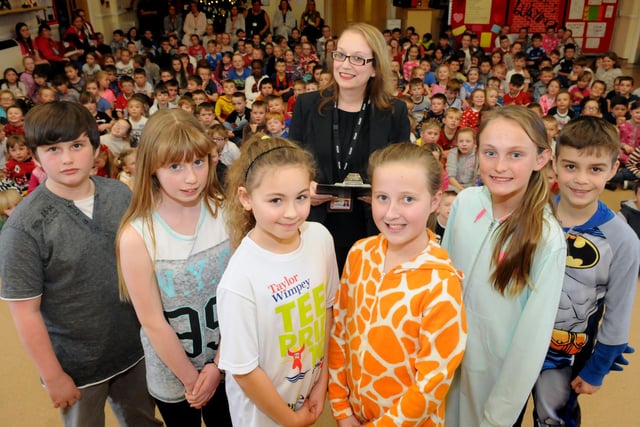 What a talented line-up. St Aidan's CofE Primary School acting headteacher Judith Skirving is pictured with year 6 pupils who took part in an Apprentice style event to raise money for the NSPCC.