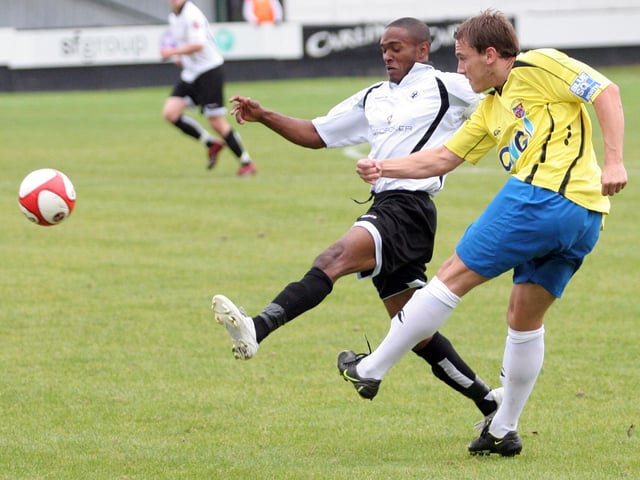 Anton Foster challenges for the ball.