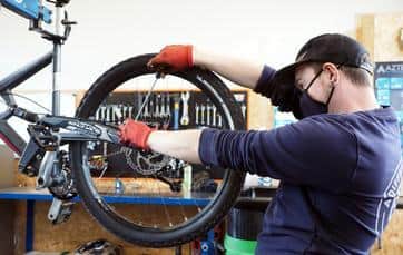 Mechanic Neil Cooke working on bikes at A Different Gear.