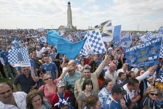 Amazing scene. Portsmouth fans celebrate as their team arrive in a open top bus as part of their victory parade at Southsea Common following their win in the FA Cup Final 2008 on May 18 2008 in Portsmouth, England. Picture: Matt Cardy/Getty Images
