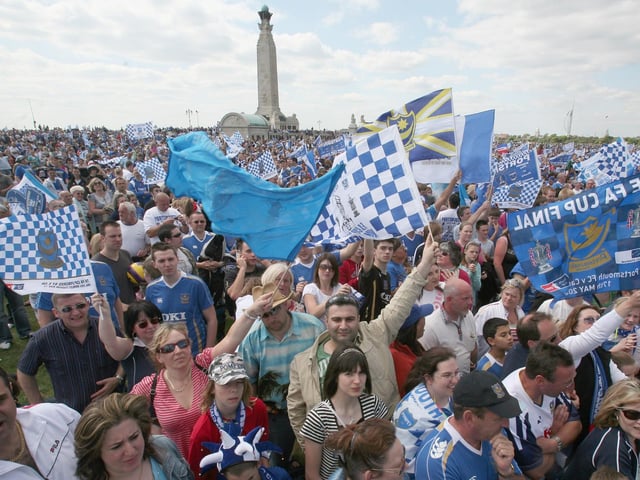 Amazing scene. Portsmouth fans celebrate as their team arrive in a open top bus as part of their victory parade at Southsea Common following their win in the FA Cup Final 2008 on May 18 2008 in Portsmouth, England. Picture: Matt Cardy/Getty Images