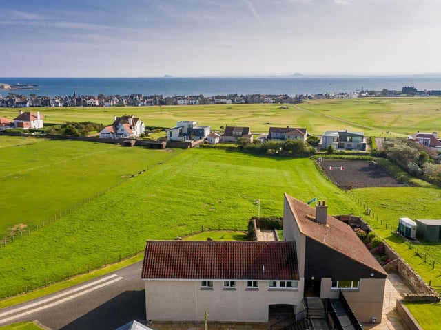 Aerial view of house and paddock.