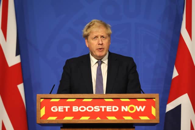 Britain's Prime Minister Boris Johnson updates the nation about the spread of the Omicron Covid variant during a Downing Street press briefing on Tuesday, January 4 (Photo by Jack Hill - WPA Pool/Getty Images)