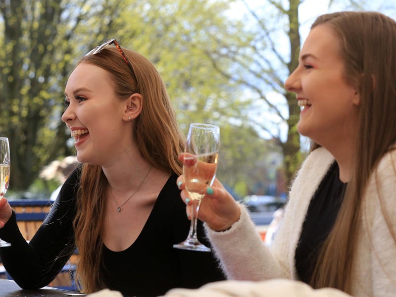 Enjoying a glass of wine in the sun at The Forum, Sheffield are Eve Sharpe and Katie James