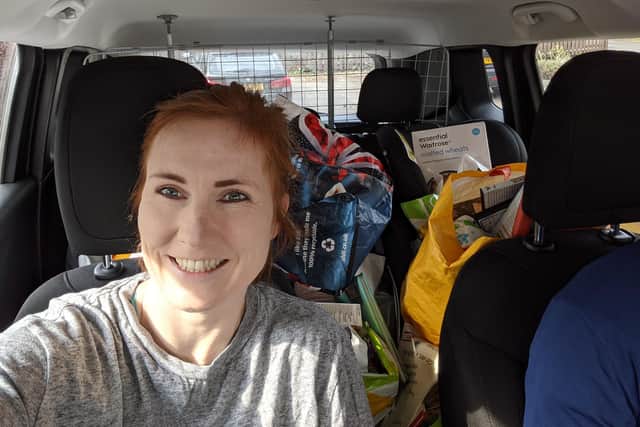 Frankie Arundel in her car delivering the food parcels on behalf of Firth Park Academy