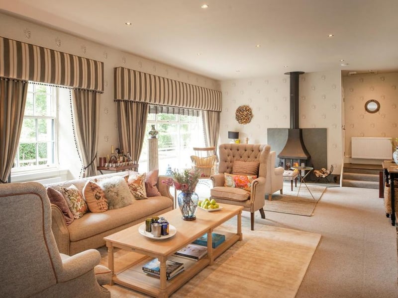 Sitting room - the property has been tastefully decorated using Farrow and Ball colours and enhanced by wallpapers from Ralph Lauren, Moon, Andrew Martin and Lewis & Wood.