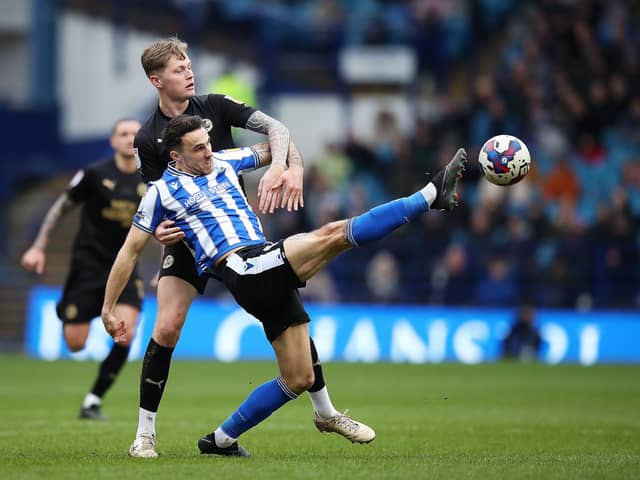 Sheffield Wednesday's Lee Gregory and Peterborough United's Frankie Kent. (Isaac Parkin/PA Wire)