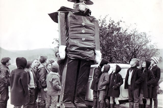 Children of the Fairthorn Convalescent Home, Dore, look up in amazement at the giant Guy Fawkes which has been made for the bonfire and firework display organised by the Riverdale Round Table, Limb Lane, November 2, 1968