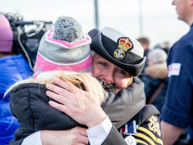 Jenni Smith embraces with Evelyn 7 in front of HMS Defender. Picture: Habibur Rahman