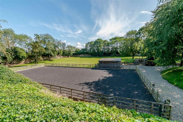 The property is situated amid approximately 4.5 acres of land and includes excellent equestrian facilities, including four paddocks, a floodlit all weather menage, two stables, a barn, feed store and tack room.