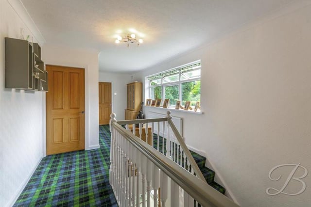 Time to go upstairs, where this lovely landing leads to all four bedrooms and the main bathroom. It has a carpeted floor and a central-heating radiator.