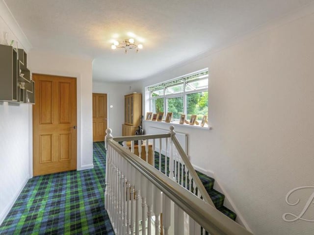 Time to go upstairs, where this lovely landing leads to all four bedrooms and the main bathroom. It has a carpeted floor and a central-heating radiator.