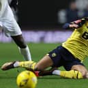 OXFORD, ENGLAND - JANUARY 09: Josh Murphy of Oxford United is tackled by Eddie Nketiah of Arsenal during the Emirates FA Cup Third Round match between Oxford United and Arsenal at Kassam Stadium on January 09, 2023 in Oxford, England. (Photo by Richard Heathcote/Getty Images)
