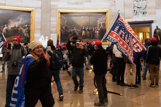 Demonstrators breeched security and entered the Capitol as Congress debated the a 2020 presidential election Electoral Vote Certification.