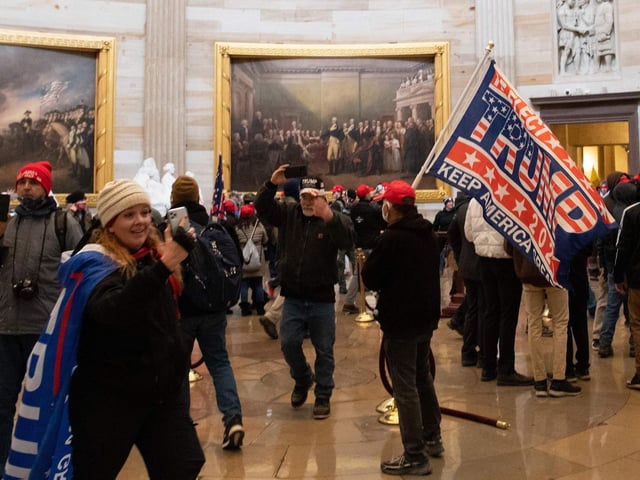 Demonstrators breeched security and entered the Capitol as Congress debated the a 2020 presidential election Electoral Vote Certification.