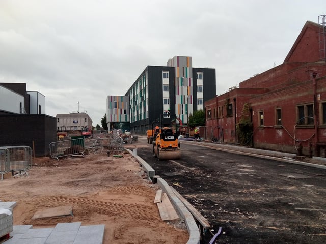 Access road under construction off Waterdale, with the new University College in the background, and the back of the new cinema site on the left