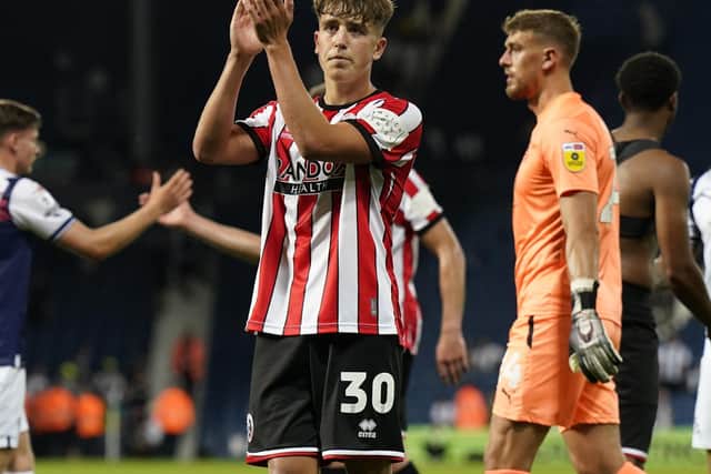 Oliver Arblaster of Sheffield United applauds the fans after making his debut at West Brom: Andrew Yates / Sportimage