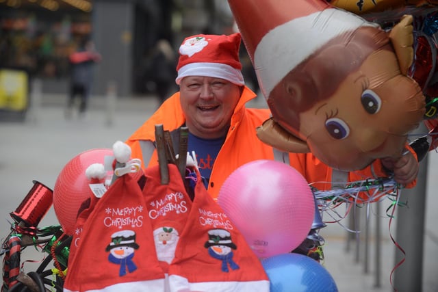 Christmas balloon trader Craig Dobson having a busy day