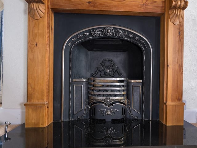 Feature fireplace in sitting room.