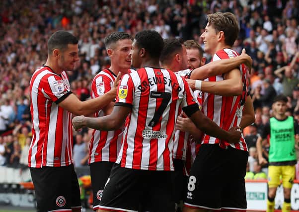 Sander Berge of Sheffield United (r) celebrates scoring the second goal during the Sky Bet Championship match at Bramall Lane against Millwall: Simon Bellis / Sportimage