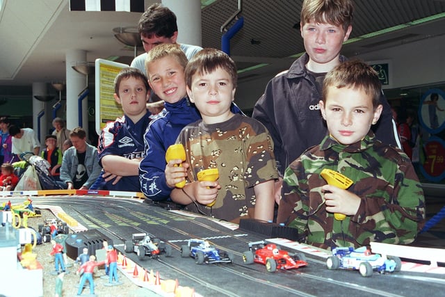 Model car racing championships were held in 1999. Seen are drivers Aaron Blakemore, Matthew Cryer, Ryan Burton, and Lee Marshall in action.