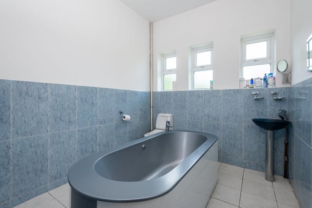 This is the main bathroom shared between the bedrooms without en-suites or their own washing facilities. It's modern appearance does slightly differ from the other bathrooms in the house but looks stunning.