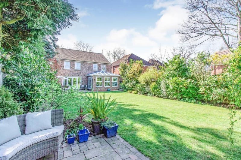 Large landscaped garden to the rear which has a range of evergreen, mature shrubs and trees to the borders. There is a good sized patio area which is perfect for entertaining and alfresco dining with outdoor lighting.