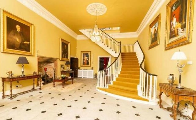 Double doors lead into the generous sized hall with a magnificent sweeping main staircase and feature stone fire surround