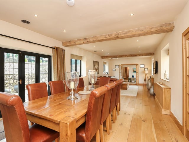 The room has doors which open up onto the patio.