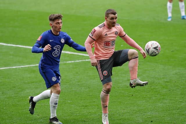 John Fleck holds off his fellow Scot Billy Gilmour at Chelsea on Sunday: David Klein/Sportimage