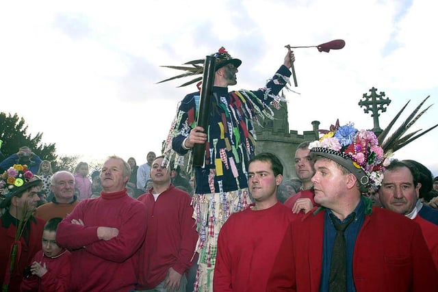 Haxey Hood Fool Dale Smith pictured in 2001. The red-coated overseer of proceedings is the Lord of The Hood. He is assisted by the Chief Boggin, ten other boggins and the Fool.
The Fool leads the procession between pubs and has the right to kiss any woman on the way.